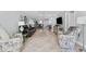 Bright and spacious living room with modern decor and tile floors at 3410 Stonehaven E Ct # A, Palm Harbor, FL 34684