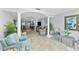 Open-concept living area with modern decor and lots of natural light at 3410 Stonehaven E Ct # A, Palm Harbor, FL 34684