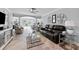 Spacious living room with tile flooring, modern furniture, and large windows at 3410 Stonehaven E Ct # A, Palm Harbor, FL 34684