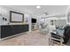 Bright living room with built-in storage, modern decor, and tile flooring at 3410 Stonehaven E Ct # A, Palm Harbor, FL 34684