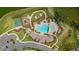 Aerial view of community amenities including pool, playground, and sports court at 34248 Redwood Dawn Ln, Wesley Chapel, FL 33543