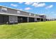 A view of the backyard and screened in patios behind the townhomes at 34248 Redwood Dawn Ln, Wesley Chapel, FL 33543