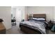 Bedroom featuring a comfortable bed, carpet flooring, and a workspace at 34248 Redwood Dawn Ln, Wesley Chapel, FL 33543