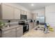 Modern kitchen boasts granite countertops, stainless steel appliances, and neutral cabinets at 34248 Redwood Dawn Ln, Wesley Chapel, FL 33543