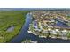An aerial view of a waterfront neighborhood with lush foliage, serene water views, and easy boat access at 3936 Crooked Island Dr, Punta Gorda, FL 33950