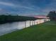 Beautiful evening view of the property's private boat dock along the serene waterfront canal at 3936 Crooked Island Dr, Punta Gorda, FL 33950