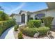 Charming single-Gathering home with lush tropical landscaping, manicured shrubs, and a decorative walkway at 3936 Crooked Island Dr, Punta Gorda, FL 33950