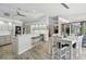 Bright, open kitchen with breakfast bar, stainless steel appliances, pendant lighting, and dining area at 3936 Crooked Island Dr, Punta Gorda, FL 33950