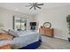 Serene bedroom with waterfront views from the sliding glass door leading to an outdoor patio at 3936 Crooked Island Dr, Punta Gorda, FL 33950