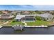 Waterfront property featuring screened-in pool, private dock, and picturesque views of the surrounding community at 3936 Crooked Island Dr, Punta Gorda, FL 33950