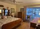 Comfortable bedroom with poolside access and a beautiful flamingo-themed bed at 405 Bryn Mawr Is, Bradenton, FL 34207