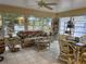 Bright sunroom offers a relaxing space with views of the surrounding scenery at 405 Bryn Mawr Is, Bradenton, FL 34207
