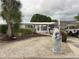 Charming single story home with lovely landscaping, a unique mailbox, and covered parking at 405 Bryn Mawr Is, Bradenton, FL 34207