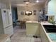 Spacious kitchen with adjacent dining area featuring tiled floors and an open layout at 405 Bryn Mawr Is, Bradenton, FL 34207