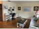 Comfortable living room featuring a workstation, plush seating, and stylish decor at 405 Bryn Mawr Is, Bradenton, FL 34207