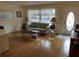Cozy living room featuring a comfortable sofa, elegant lamps, and a decorative glass door at 405 Bryn Mawr Is, Bradenton, FL 34207