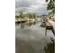 Picturesque waterfront view showcasing dock area with boats and calm waterway at 405 Bryn Mawr Is, Bradenton, FL 34207
