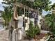 Unique nautical accents adorn the yard, adding to the property's waterfront charm at 405 Bryn Mawr Is, Bradenton, FL 34207