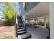 Outdoor patio area with stairs leading to backyard with covered parking and additional seating at 4100 Miramar Way, St Petersburg, FL 33705