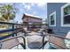 Inviting outdoor deck with comfortable seating and a view of neighboring homes at 4100 Miramar Way, St Petersburg, FL 33705