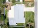 Birds eye view of house, showcasing modern gray roof, neat yard, and convenient driveway at 4200 49Th S Ave, St Petersburg, FL 33711