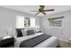 Relaxing bedroom with decorative pillows, hardwood floors, and side tables at 4200 49Th S Ave, St Petersburg, FL 33711