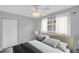 Serene bedroom with neutral tones, plush bedding, and a large window at 4200 49Th S Ave, St Petersburg, FL 33711