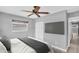 Modern bedroom featuring a television, hardwood floors, window, closet, and ceiling fan at 4200 49Th S Ave, St Petersburg, FL 33711