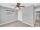 Neutral bedroom showcasing hardwood floors, window, closet, and ceiling fan at 4200 49Th S Ave, St Petersburg, FL 33711