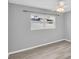 Comfortable bedroom featuring gray walls, hardwood floors and a modern ceiling fan at 4200 49Th S Ave, St Petersburg, FL 33711
