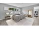 Beautifully staged bedroom, featuring an accent mirror, with a serene decor and soft lighting at 4200 49Th S Ave, St Petersburg, FL 33711