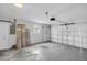 Spacious garage with bare concrete floor and white walls with a window at 4200 49Th S Ave, St Petersburg, FL 33711