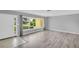 Bright living room with large windows, stylish flooring, and a welcoming entryway at 4200 49Th S Ave, St Petersburg, FL 33711