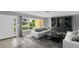 Staged living room with comfortable seating, elegant decor, and a view of the home's exterior at 4200 49Th S Ave, St Petersburg, FL 33711