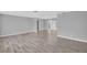 Spacious living room featuring sleek flooring, neutral paint, and ample natural light at 4200 49Th S Ave, St Petersburg, FL 33711