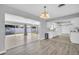 Open living space with a kitchen, dining area, and sliding glass doors to the backyard at 4200 49Th S Ave, St Petersburg, FL 33711