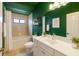 Modern bathroom features a tiled shower, vanity, and decorative shelving at 4264 Michaler St, North Port, FL 34286