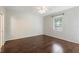 Bright bedroom with hardwood floors, a ceiling fan, and a window that provides natural light at 4264 Michaler St, North Port, FL 34286