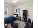 Bright bedroom features a twin bed, a ceiling fan, and a picture of a soccer player at 4264 Michaler St, North Port, FL 34286