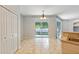 Bright dining area with tile flooring, sliding glass doors and chandelier at 4264 Michaler St, North Port, FL 34286