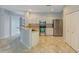 Bright kitchen featuring stainless steel appliances, light countertops, and tile flooring at 4264 Michaler St, North Port, FL 34286