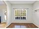 Well lit living room featuring hardwood flooring, and a large window at 4264 Michaler St, North Port, FL 34286