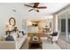 Bright living room with hardwood floors, stylish furniture, and an open floor plan to the kitchen and dining area at 4264 Michaler St, North Port, FL 34286