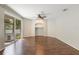 Open living room with ceiling fan and sliding doors leading to patio at 4264 Michaler St, North Port, FL 34286