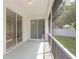 Covered patio features sliding glass doors, screens, and an outdoor space at 4264 Michaler St, North Port, FL 34286