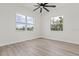Minimalist bedroom with hardwood floors, natural light, and a serene atmosphere at 4513 21St N St, St Petersburg, FL 33714