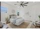 Bright bedroom with a large ceiling fan, neutral decor and natural light from the windows at 4513 21St N St, St Petersburg, FL 33714