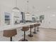 Bright and airy kitchen with a huge island, bar stool seating, and modern pendant lighting at 4513 21St N St, St Petersburg, FL 33714