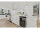 Open concept kitchen with a wine fridge, stainless steel appliances, and stylish cabinetry at 4513 21St N St, St Petersburg, FL 33714