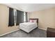 Comfortable bedroom with window, curtains, carpet and accent pillows at 4521 Tidal Pond Rd, New Port Richey, FL 34652